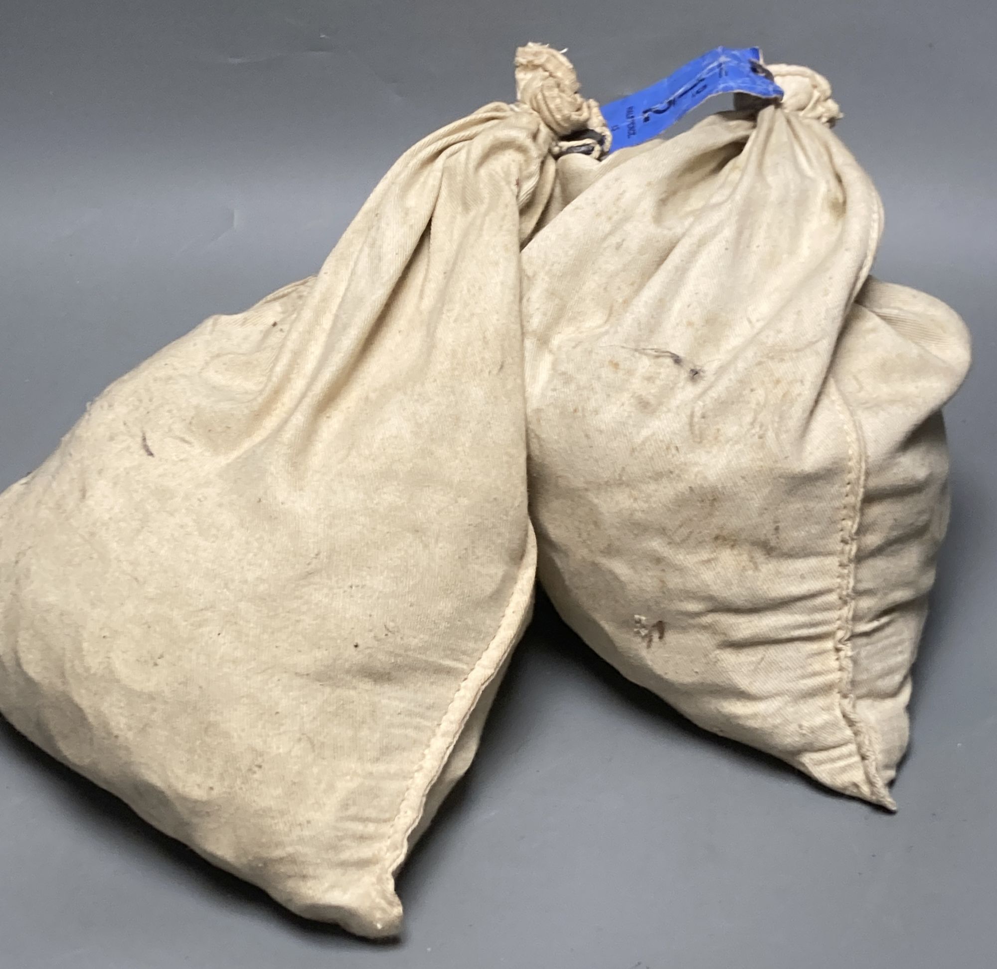 Two sacks of Elizabeth II half pennies, weighing 13.70kg each